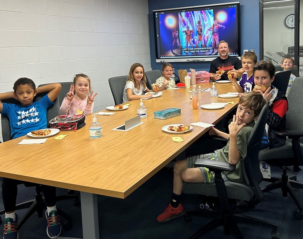 Students having lunch with their principal.