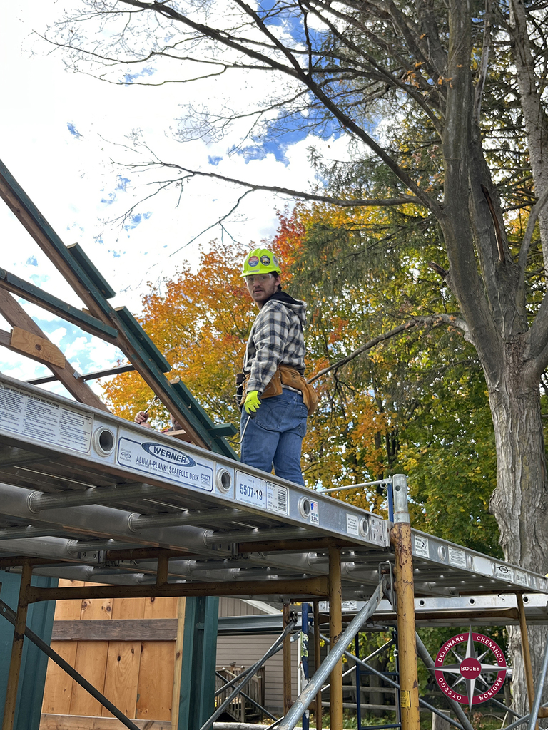 student carpenter on scaffold