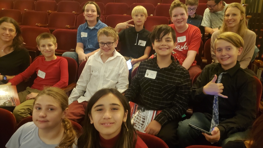 Students smile in audience at band concert