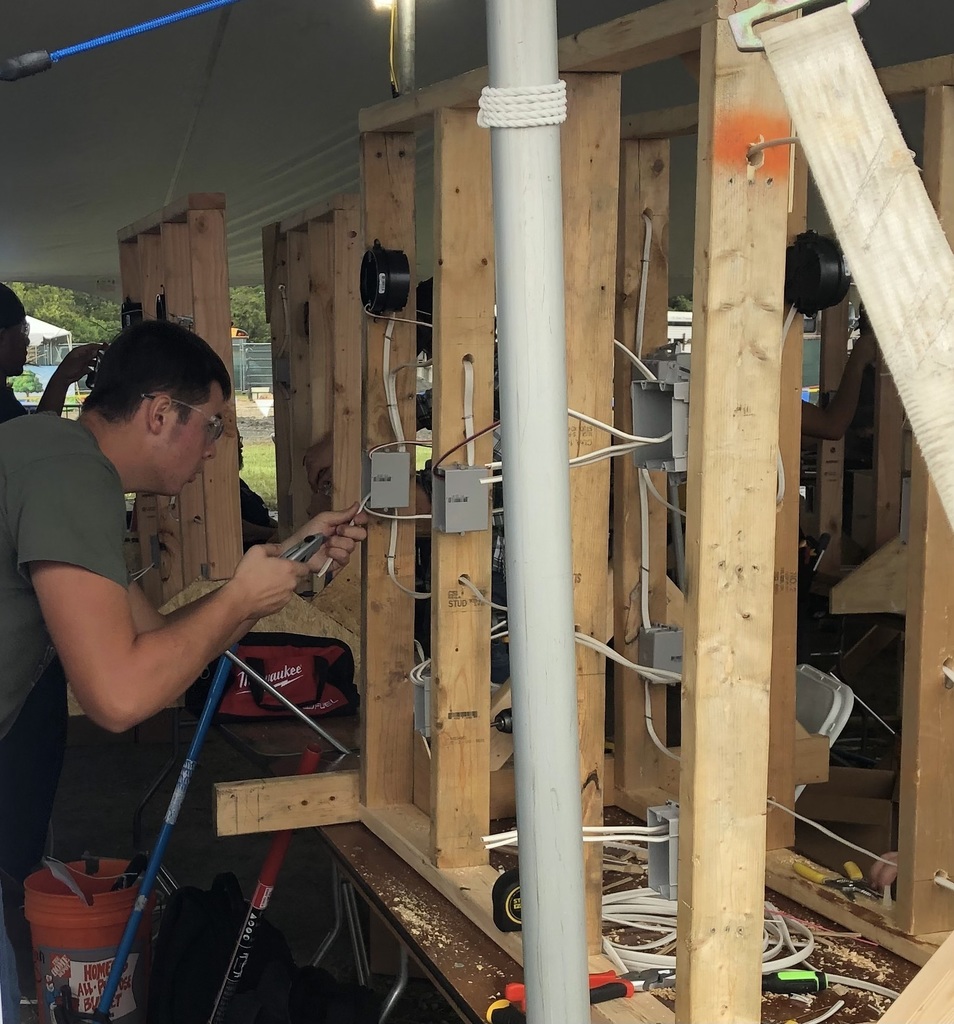 A student competes in an electricity competition.