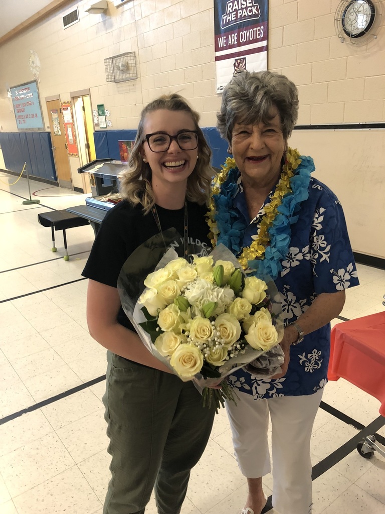 Two women with yellow roses