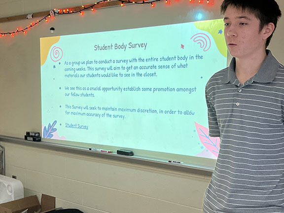 A boy speaks during a presentation.