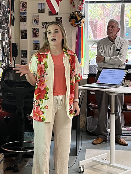 A girl speaks during a presentation.