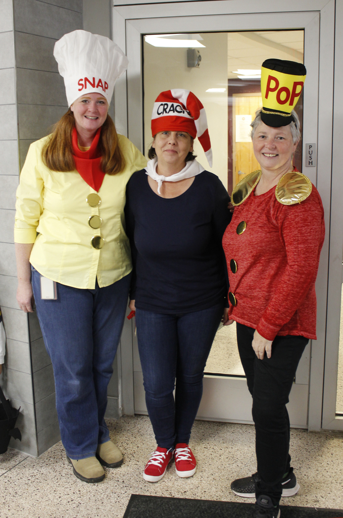 3 theachers, dressed as Snap, Crackle and Pop