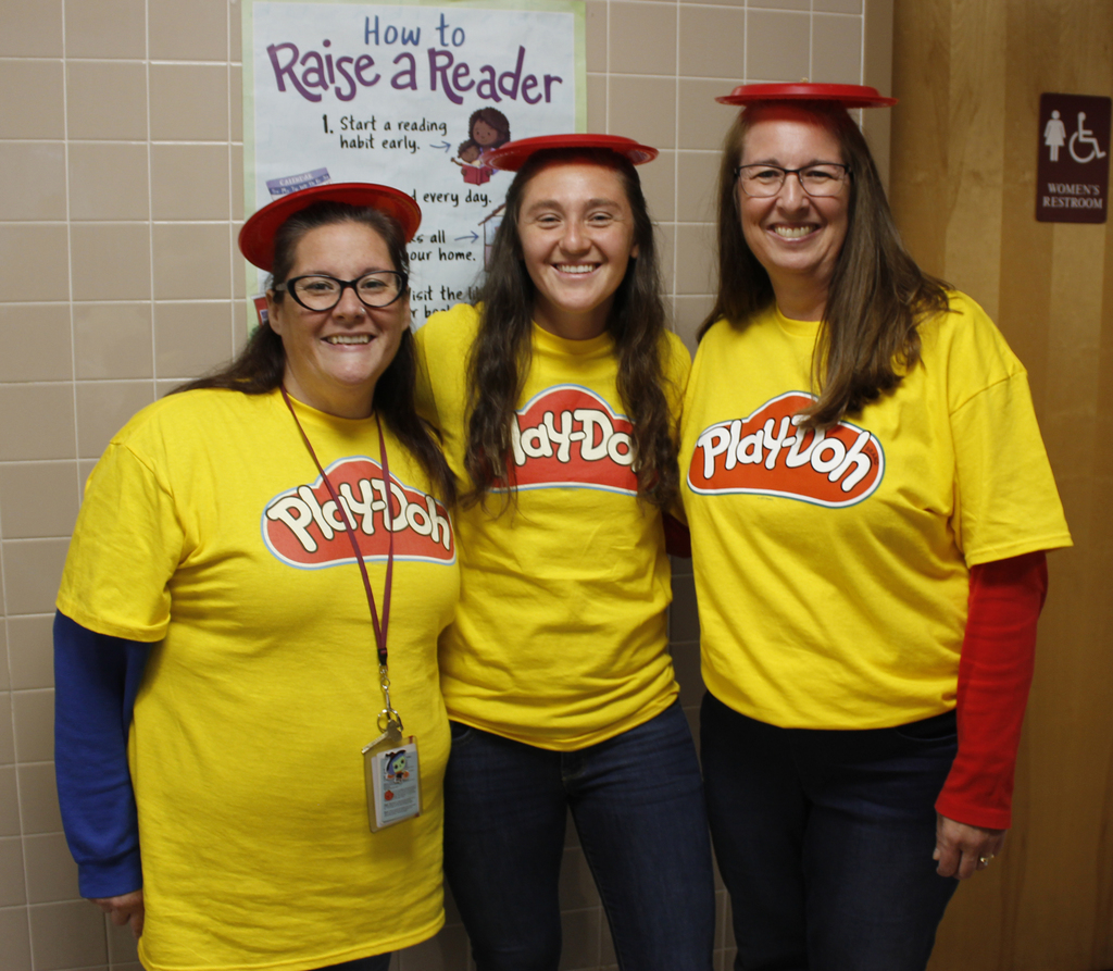 2 teachers dressed as cans of Play-Doh