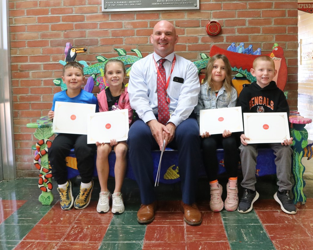 Mr. Moran with four students at Nevin Coppock recognized for being responsible.