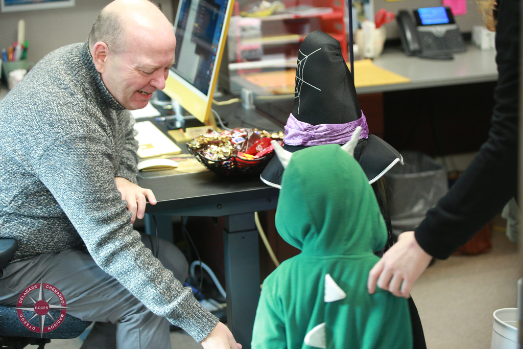 children in cstume visit graphic designer