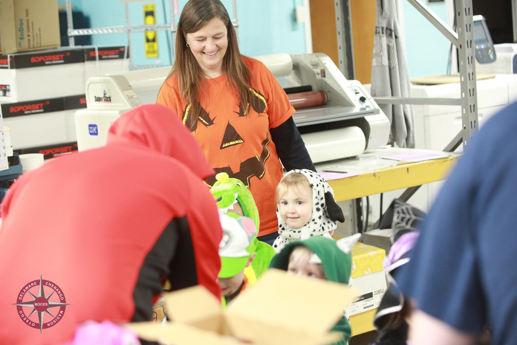 children in costume visit print shop