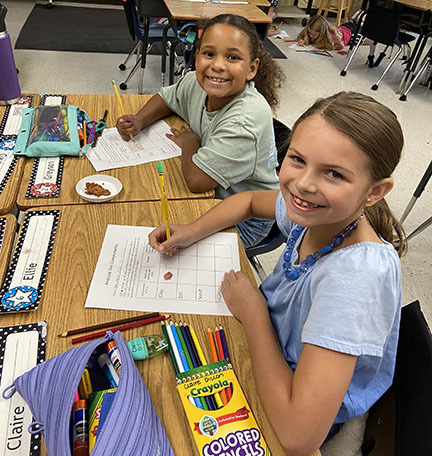 Students learn about soil during STEM Day.