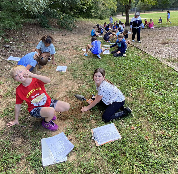 Students learn about soil during STEM Day.