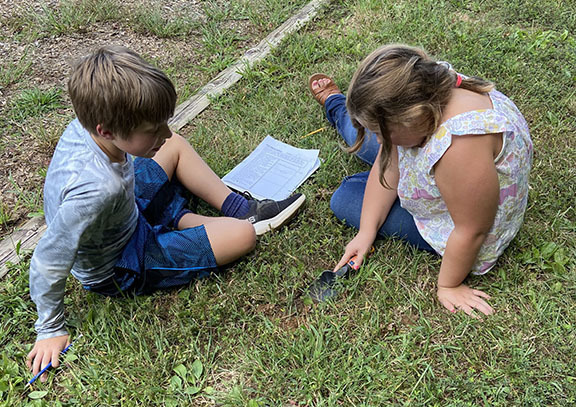 Students learn about soil during STEM Day.