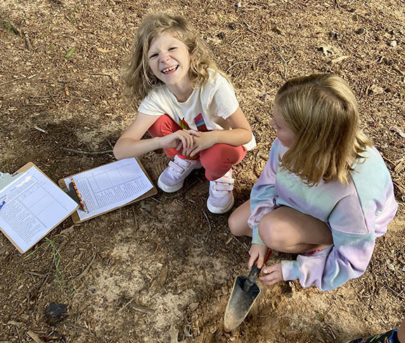 Students learn about soil during STEM Day.