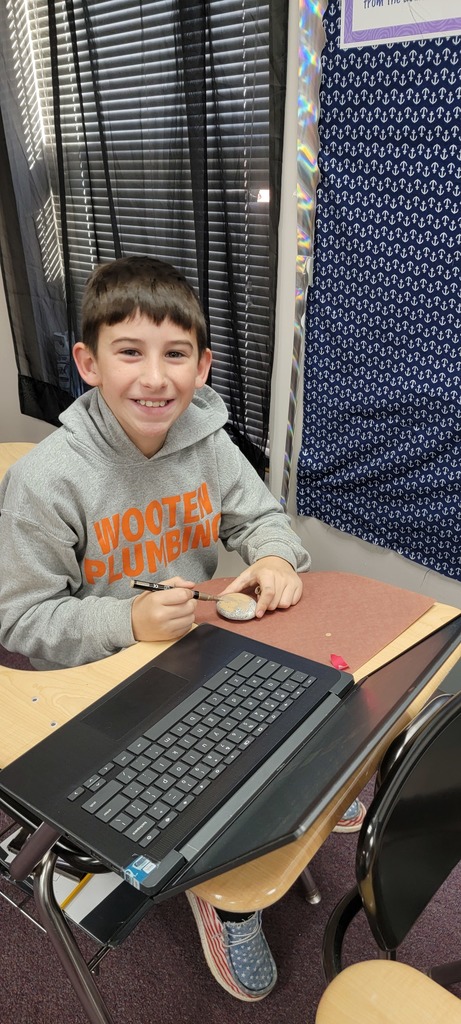 Student painting rocks