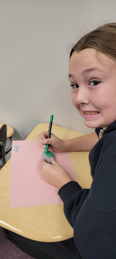 Student painting rocks