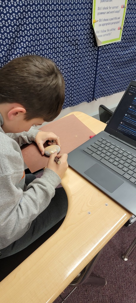 Student painting rocks