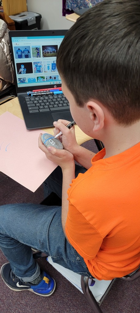 Student painting rocks