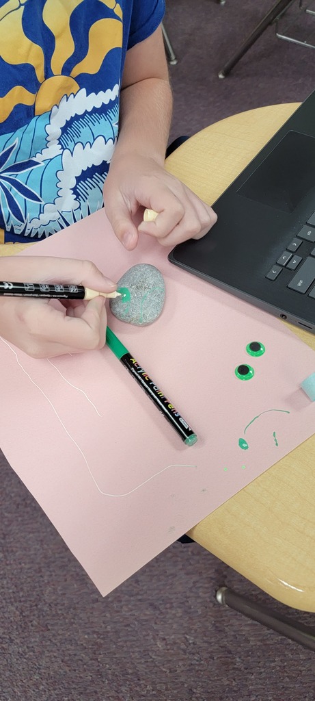 Student painting rock