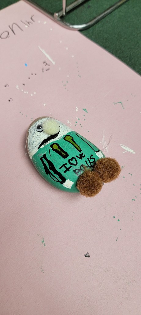 Student painting rock