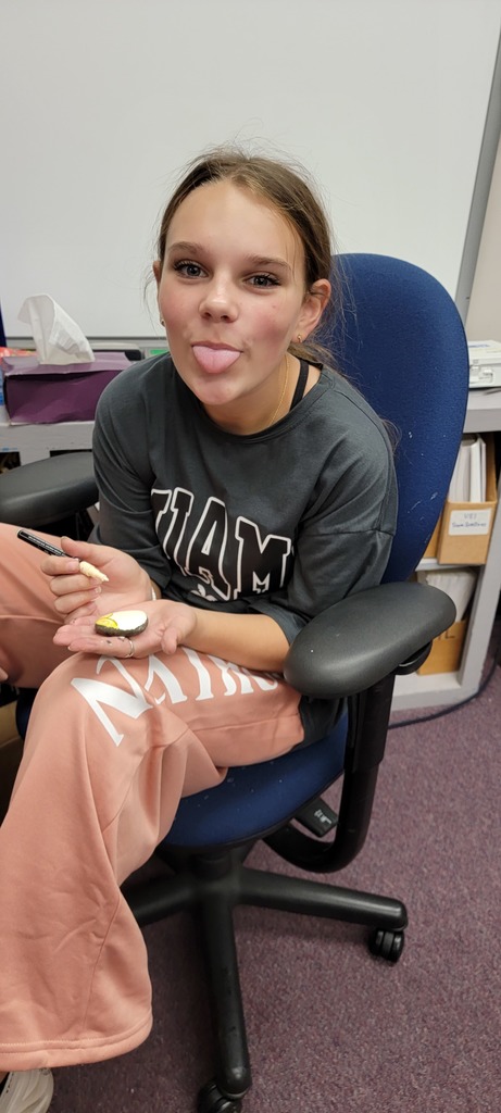 Student painting rock