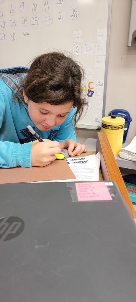 Student painting rock