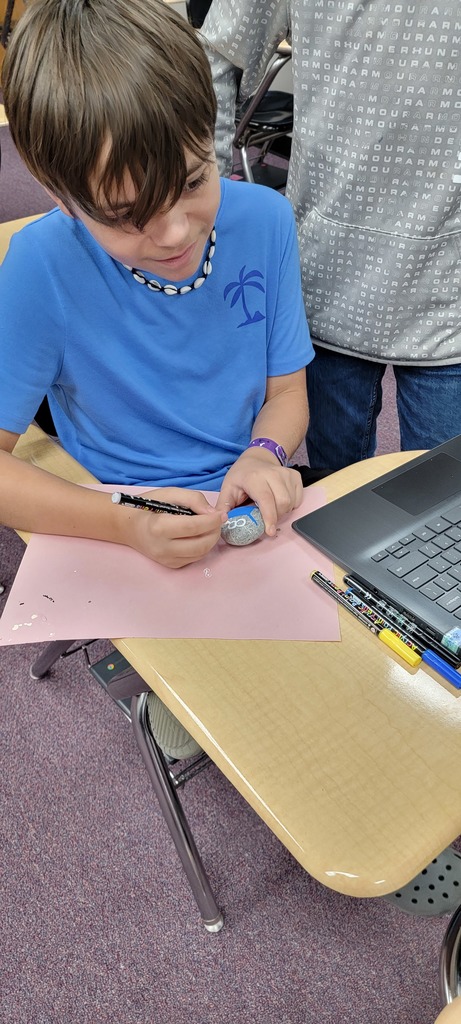 Student painting rock