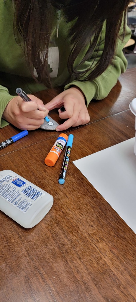 Student painting rock