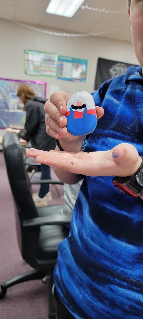 Student painting rock