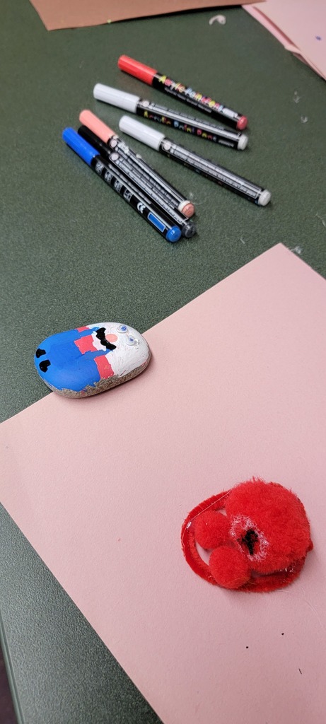 Student painting rock