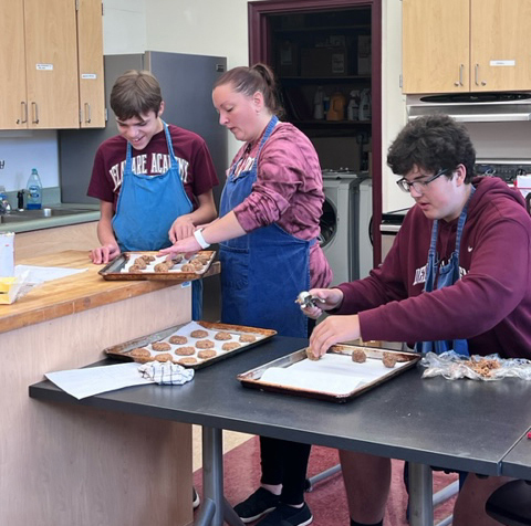 students and teacher in baking class