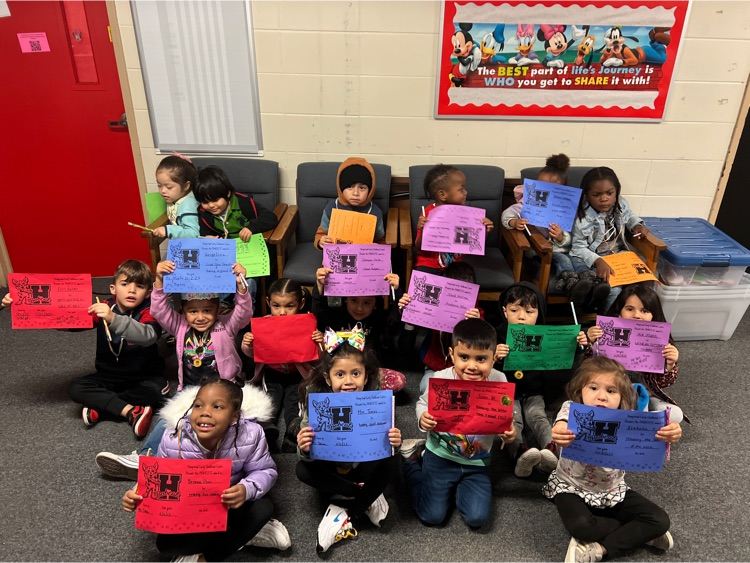 students holding award