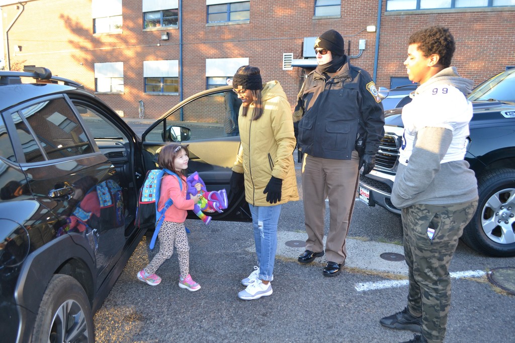 CCHS football team helps open doors during car drop off