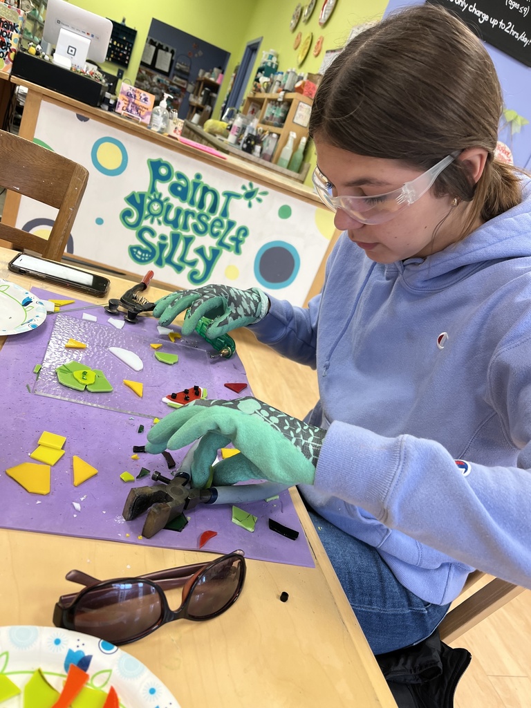 student working on a class fusion piece