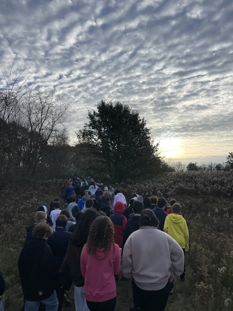 students walk down a trail