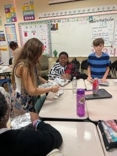 students creating boat