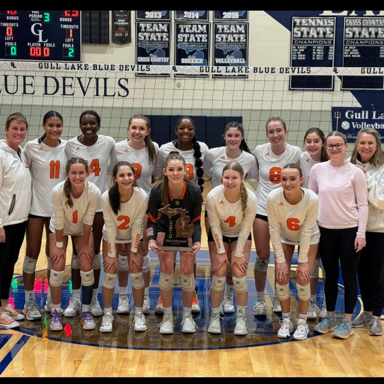 volleyball team with trophy