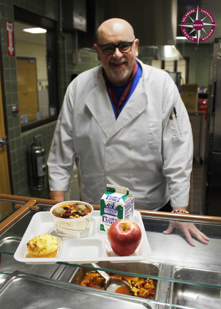Mike from food services poses with meal on a tray