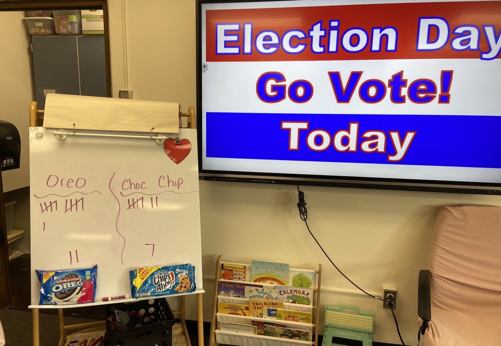 Students in Dylah Fagan’s first grade class are pictured participating in a class vote to determine which cookie is best - Oreos or chocolate chip - as part of a lesson about elections. 