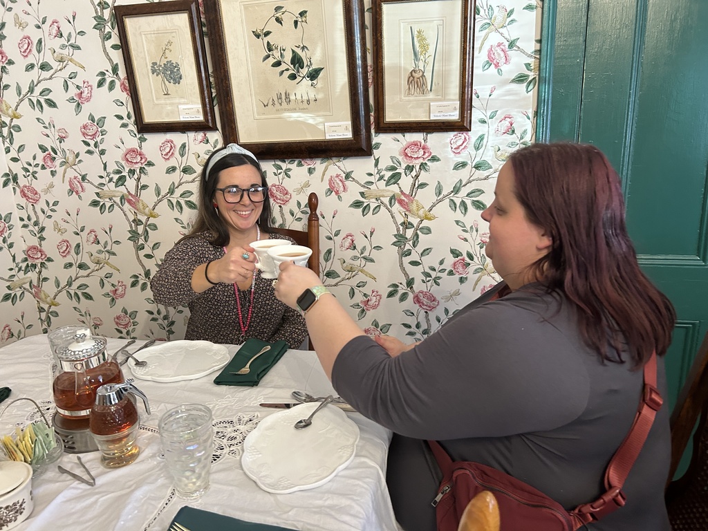 Teachers cheersing tea cups