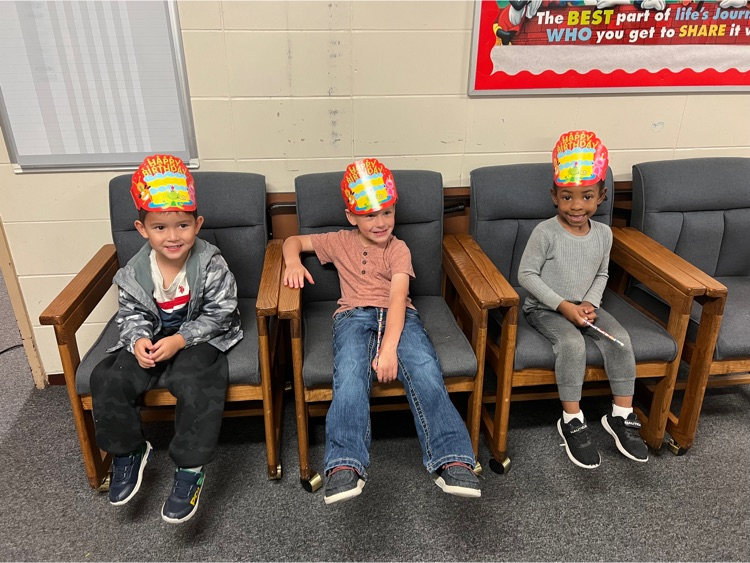 children in birthday hats