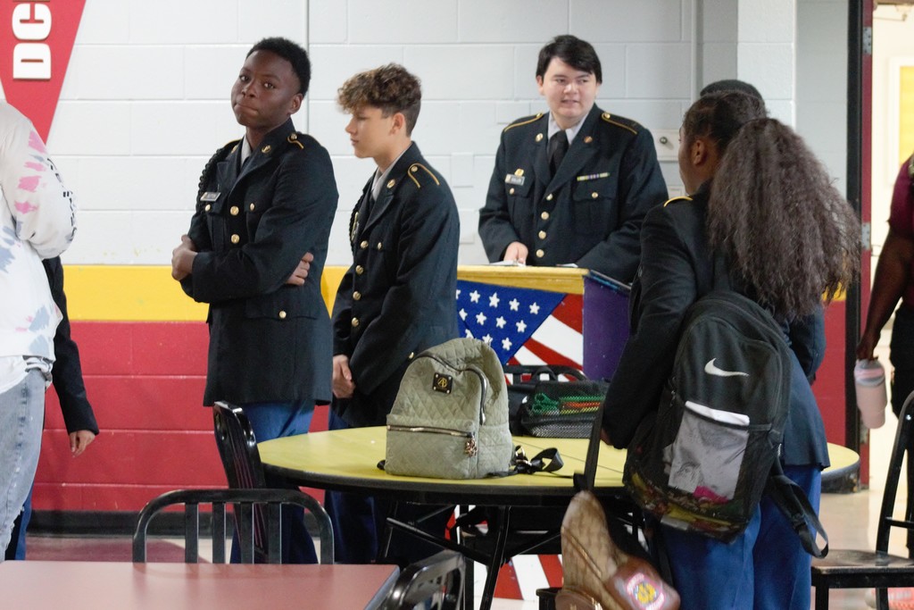 3 males and female in uniform