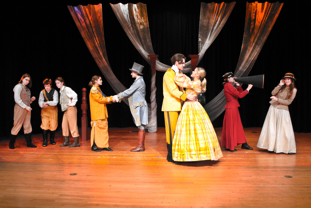 cast of Much Ado About nothing on stage in 1800's costumes