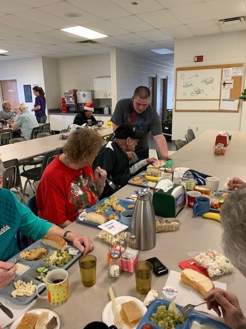 Giving cards and treats to Seniors.