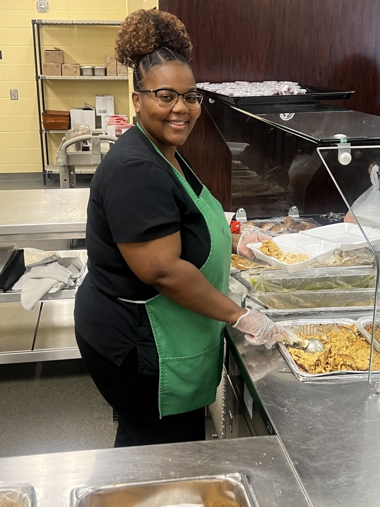 Denetria Finnissee serving Thanksgiving Dinner at VHS.