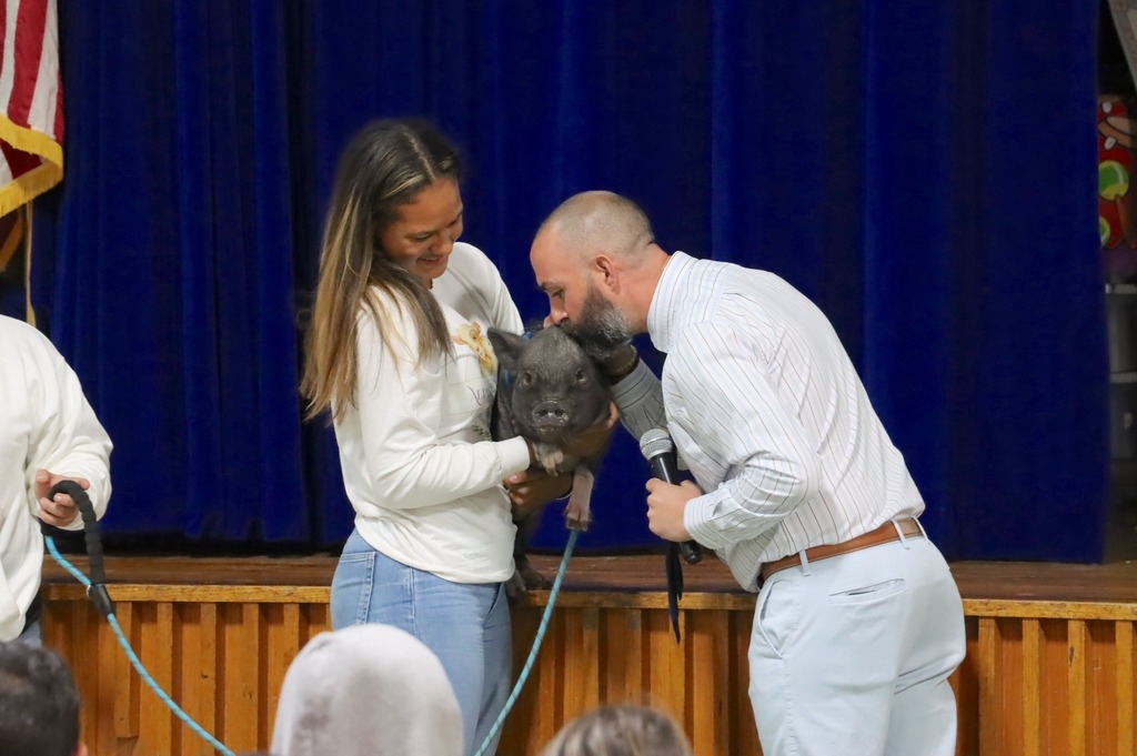 Mr. C. kisses a pig!