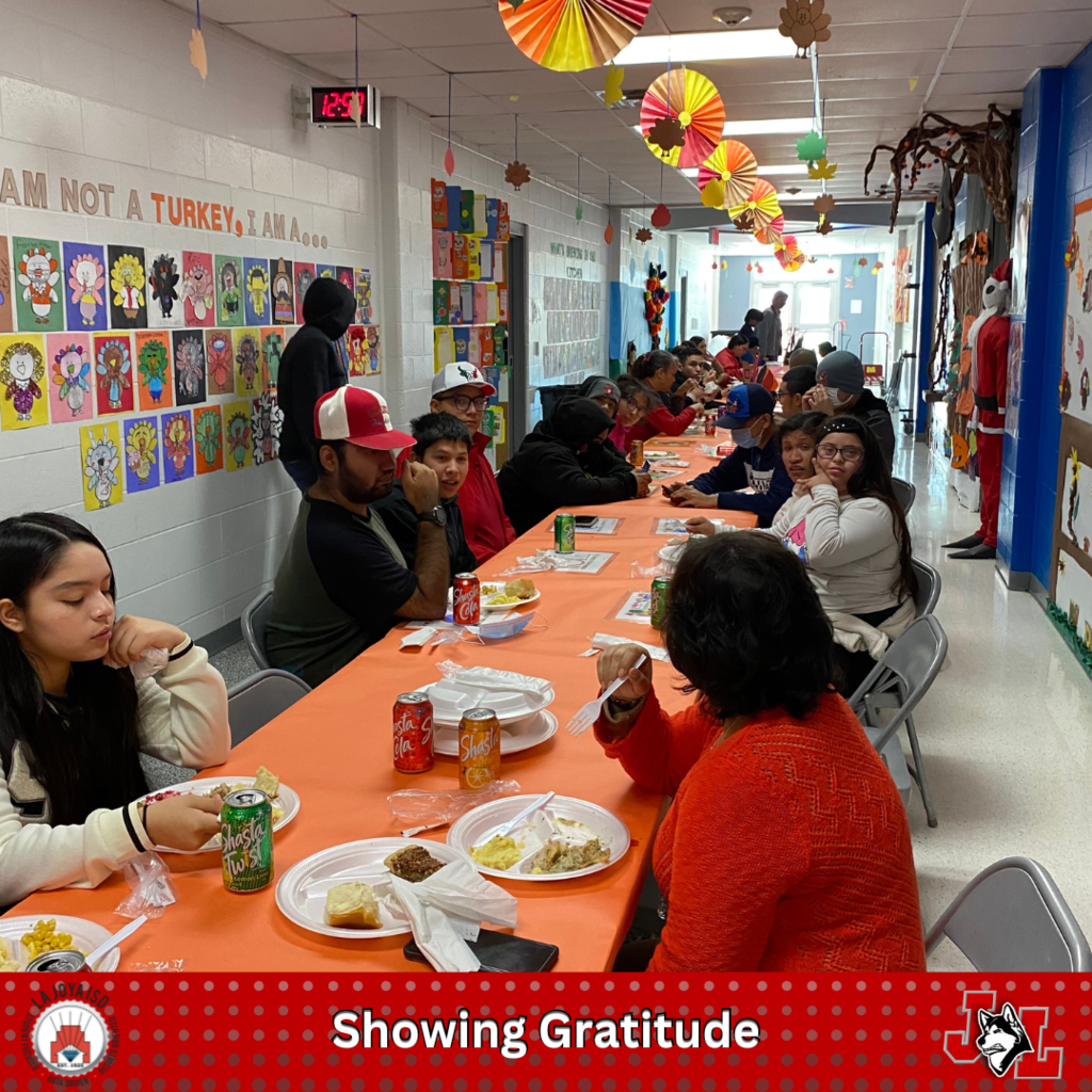 students and staff eating at a Thanksgiving luncheon