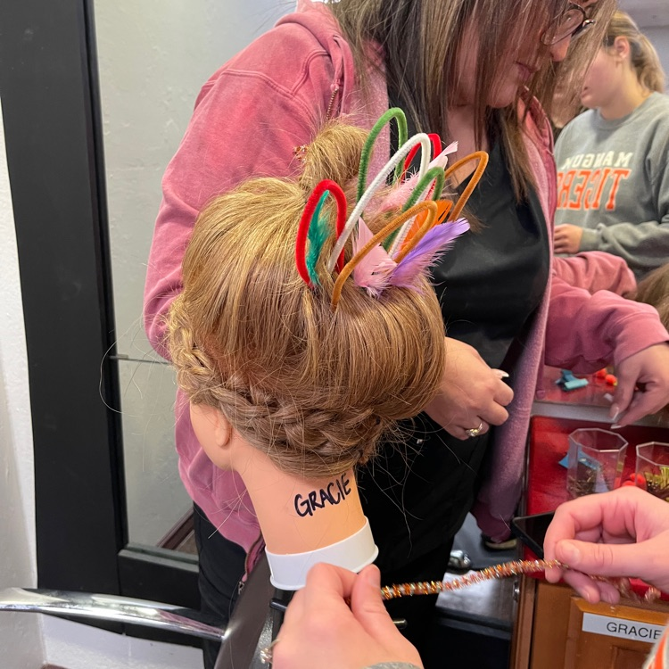 Cosmo students are pictured working on their mannequins to create Thanksgiving-inspired looks!