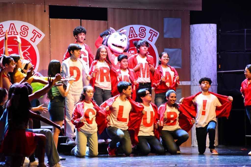 Students acting on stage