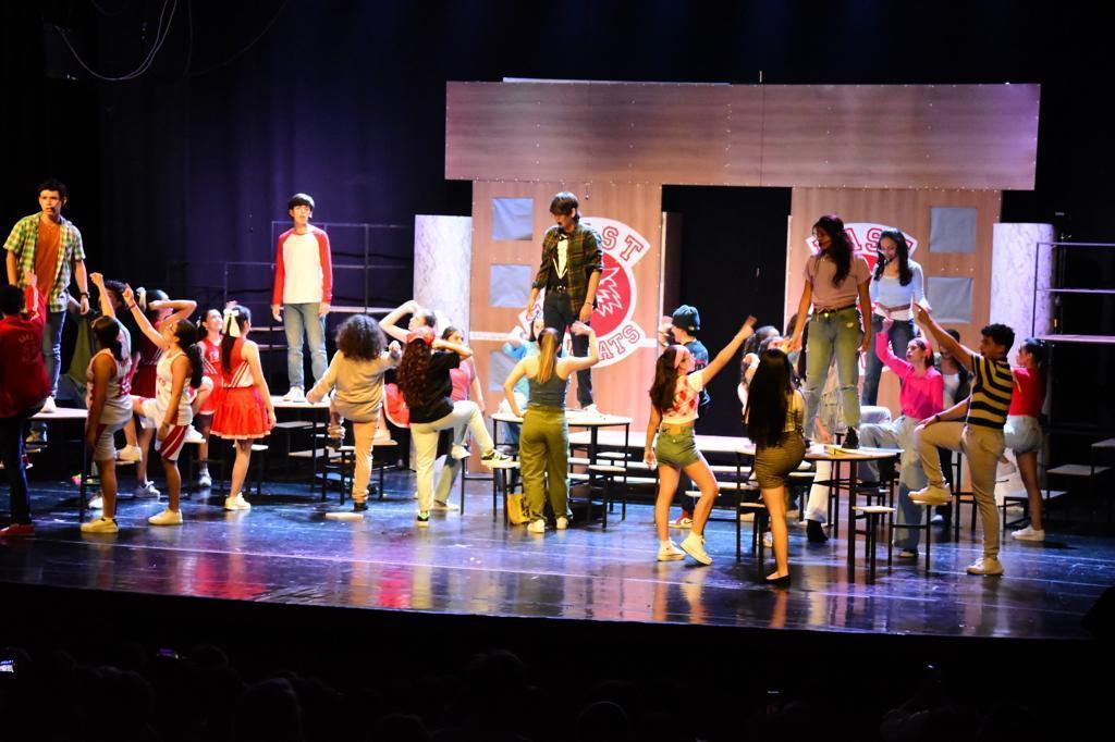 Students acting on stage