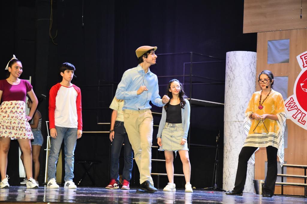 Students acting on stage