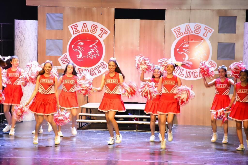 Students acting on stage